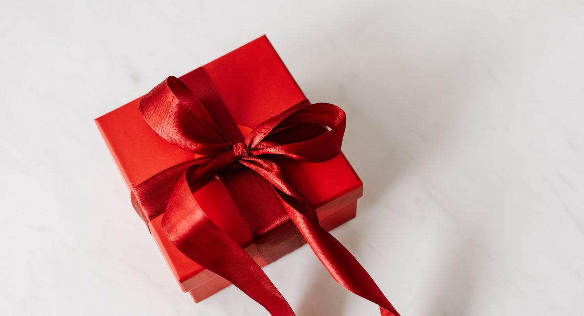 red gift box tied with ribbon